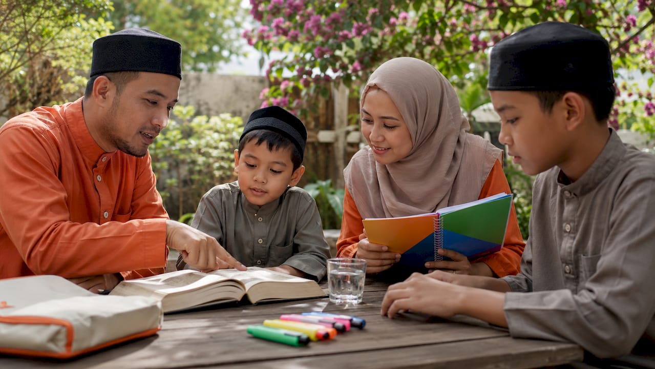 Family engaging in Quran study session